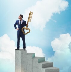 Wall Mural - Businessman with key to success at the top of career