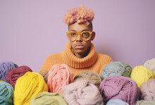 Girly Guy And A Pile Of Yarn Balls.Minimal Creative Fashion Concept.Flat Lay,top View.Generative AI