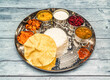 south indian vegetarian meal thali vegetables, curry, rice, raita, korma, kesari halwa and chapati served in dish isolated on wooden table top view of indian spicy food