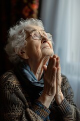 Wall Mural - sad and angry grandmother praying for help from our lord Jesus Christ