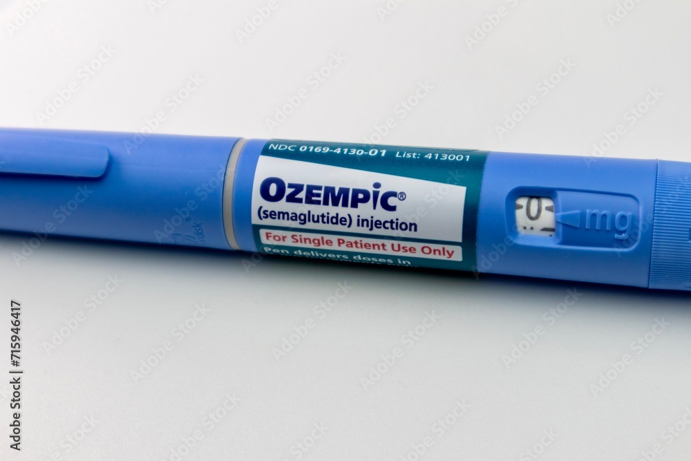 Ozempic semaglutide 1 mg injector pen on white background, close ...