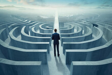 Businessman Standing At A Crossroads In A Maze, Trying To Decide Which Way To Go.