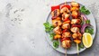 Chicken kebab skewers on a plate over light grey slate, stone or concrete background . Top view with copy space.