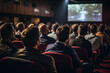 © Fukume - Audience Watching a Movie in a Theater.