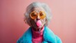 An old woman with a pink bubble in her mouth