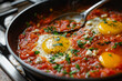 a skillet full of tomato sauce and egg stir fry