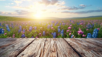 Poster - A wooden table is featured with a vibrant field of flowers as the backdrop.