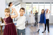 Children dance in pairs at a festive matinee
