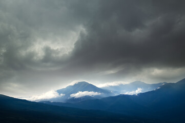 Wall Mural - Changeable weather in mountains