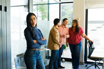 sad businesswoman being left out and rejected by her coworkers