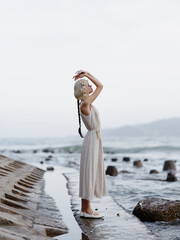 Poster - Summer Beauty: Young Woman Enjoying a Relaxing Day at the Beach, Feeling the Freedom and Attractiveness of Nature's Lure.