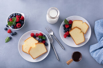 Wall Mural - Traditional pound cake sliced on a plate served with berries