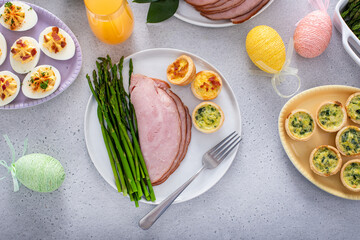 Sticker - Easter brunch table with a potion of ham with asparagus on the plate