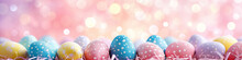 Easter Pastel Pink Background In A Banner Format With Colorful Easter Eggs And Bokeh