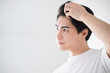 © kapinon - Man touching hairline Close-up Checking in mirror  For men's beauty and beauty