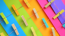 A Vibrant Display Of Functional Art, As Clothespins Adorned With Colorful Post-it Notes Dance On A String, Creating An Abstract And Eye-catching Design