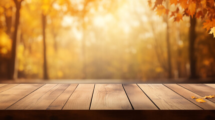 The empty wooden table top with blur background of autumn. Exuberant image.