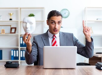 Wall Mural - Businessman wearing mask in hypocrisy concept