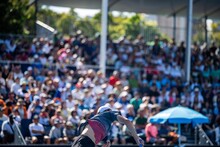 Amateur Playing Tennis At A Tournament. Professional Tennis Player Serving In Front Of A Packed Tennis Crowd Of Tennis Spectators Watching The Tennis In The Australian Open