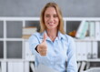 © H_Ko - Female arm show ok or approval with thumb up in creative people office closeup. High level quality product serious offer conference mediation solution advisor participation concept