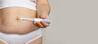 Female model holding opened blue Semaglutide Injection pen or insulin cartridge pen. Weight loss and diabetes concept.