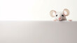 a small mouse peeks out, on a smooth background in the studio, a lot of copy space for design