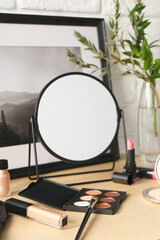 Poster - Mirror and makeup products on wooden dressing table, closeup