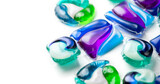 Fototapeta Na sufit - Washing capsules, colorful laundry pods border design. Colorful Soluble capsules with laundry gel detergent and dishwasher soap. Pile of washing pod capsules isolated. Detergent tablets 