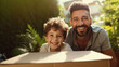 © Wararat - Happy father with son enjoy relocation day near carton box having fun.
