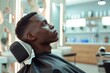 © Aida - Portrait of a black man in a barbershop