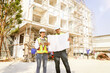 © ฺฺฺBoonterm - Male and female architects caucasian oversee construction new condominium civil engineers inspect blueprints advise planning residential projects real estate luxury and environmentally friendly.