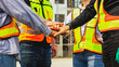 © ฺฺฺBoonterm - Team multi-ethnic workers, men and women, join hands to join forces to join forces to work for the industry for success. Teamwork and professional colleagues : Workers' hands, teamwork concept.