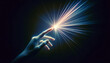 © Parminder - A human hand reaching towards a bright light, depicting discovery, inspiration, or the touch of innovation