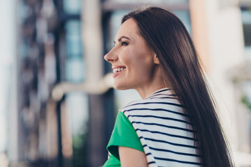 Poster - Photo of adorable good mood lady wear green t-shirt walking enjoying sunny weather outside urban city street