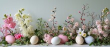 Easter Composition With A Festive Easter Garland Of Painted Eggs And Delicate Spring Flowers. Easter Card With Copy Space