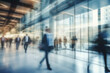 © FoxTok - Abstract bokeh background. Blurred background business people in suits walk in hall of modern glass office, corridor of business center, shopping center, bank. Business concept