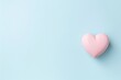 © stopabox - Pink heart on pastel blue background. Happy Valentine's Day greeting card top view.
