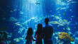 A family exploring a large aquarium marveling at the diverse marine life and learning about ocean conservation.