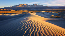 Sand Dunes At Sunrise Casting Long Shadows And Highlighting The Ripples In The Sand.