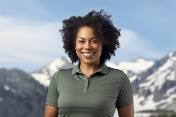 Wall Mural - Portrait of a grinning afro-american woman in her 30s wearing a breathable golf polo against a backdrop of an arctic landscape. AI Generation
