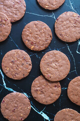 Wall Mural - Homemade chocolate shortbread with fruits and nuts on marble background