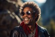 Portrait of a grinning afro-american man in his 50s wearing a trendy sunglasses against a rocky cliff background. AI Generation