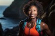 Portrait of a blissful afro-american woman in her 40s wearing a lightweight running vest against a spectacular sea cave background. AI Generation