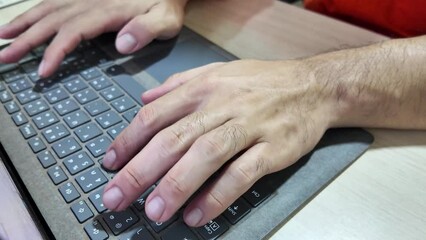 Wall Mural - Action of a worker hand is typing keyboard (Englight and Thai text) to input to report. Business working 4k footage.