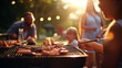 Closeup of a group of people having a barbecue outside.