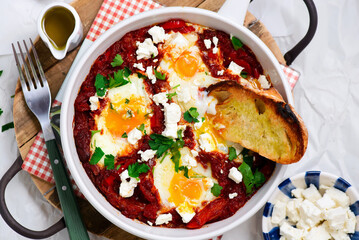 Sticker - Shakshukka with feta and bread.traditional moroccan dish. selective focus. hugge style