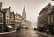 Vintage black and white (sepia) photograph of the old town of the 19th century with fog and smoke, streets in the old town, Old photograph,