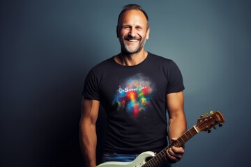 Wall Mural - Portrait of a grinning man in his 40s sporting a vintage band t-shirt with a guitar against a plain white digital canvas. AI Generation