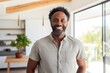 © CogniLens - Portrait of a cheerful afro-american man in his 40s sporting a breathable hiking shirt against a crisp minimalistic living room. AI Generation