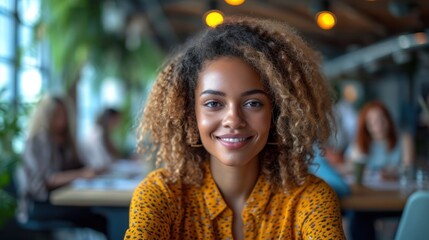 Poster -  a close up of a person sitting at a table with a plate of food in front of her and a woman in the background looking at the camera with a smile.